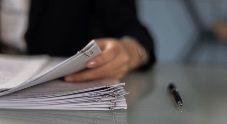 Person reviewing monthly finances with help from a debt counsellor near me