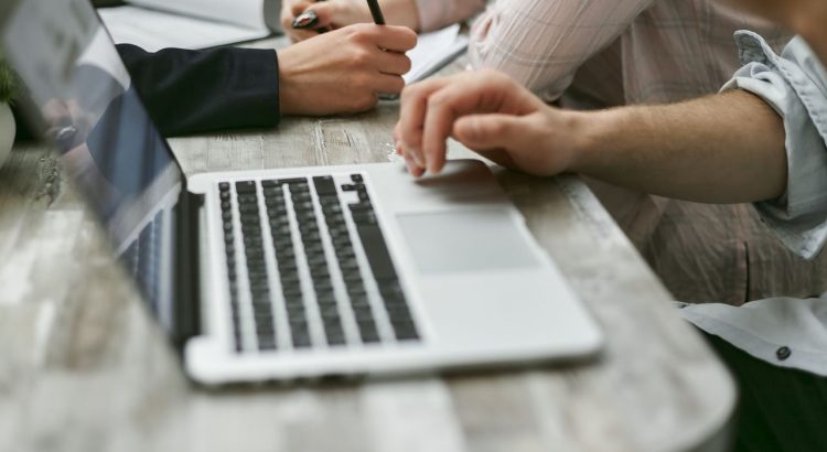 Business professional reviewing organised digital information on a computer